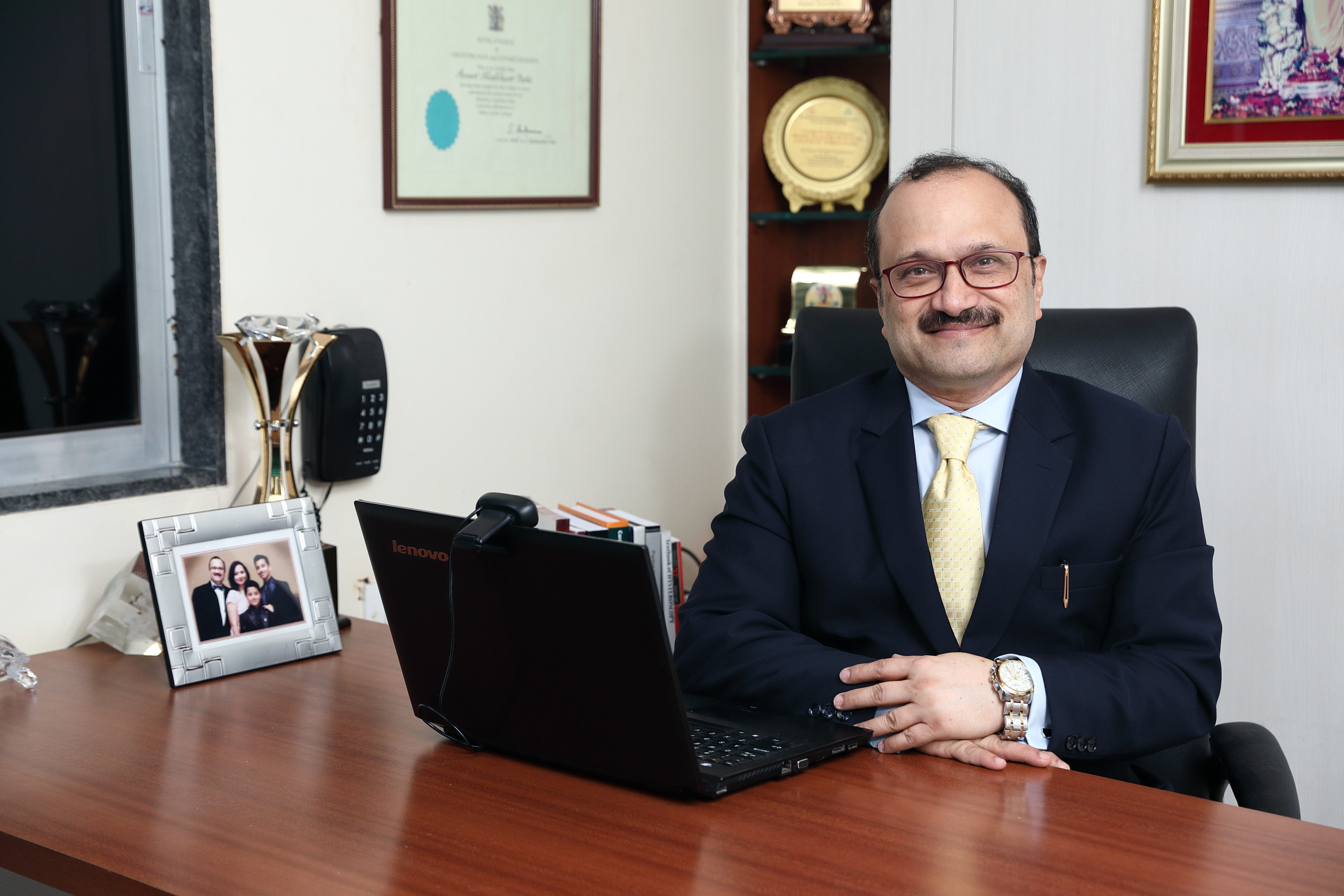 Dr. Ameet Patki at desk
